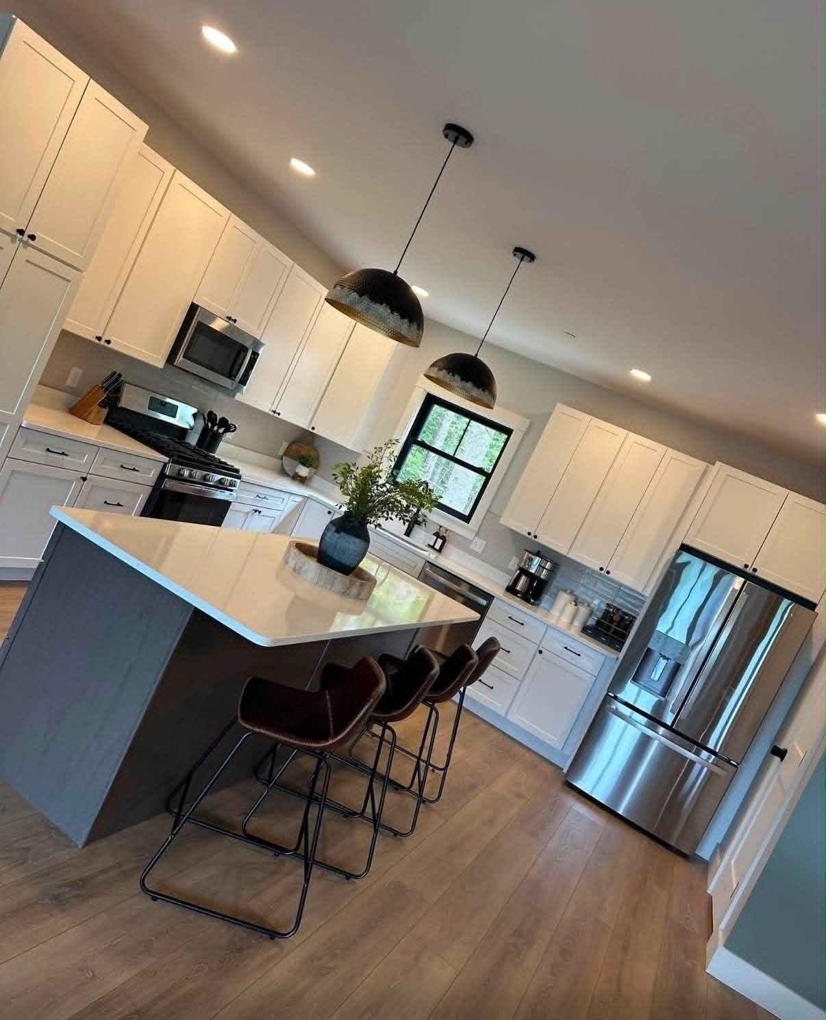 Island kitchen, countertops gleaming