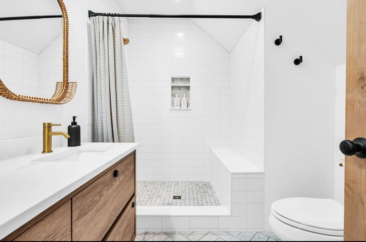 Walk-in tiled shower, polished and bright