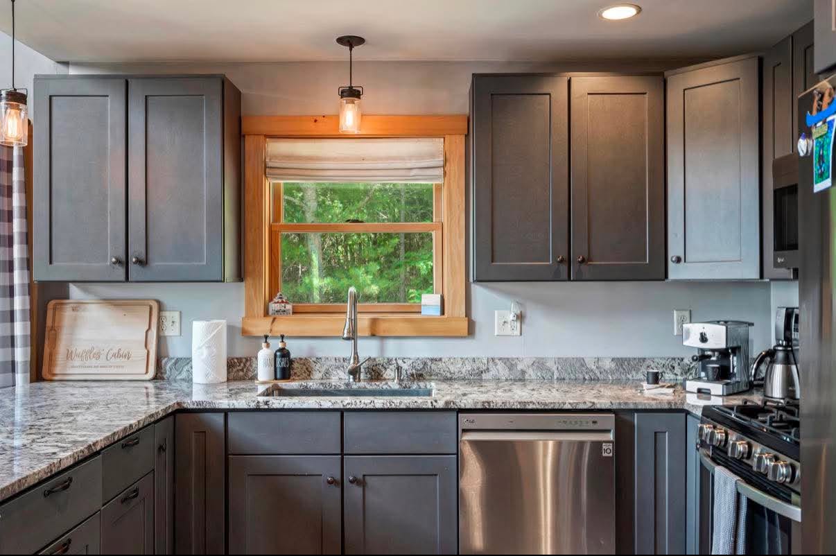 Slate-gray cabin kitchen, spotless