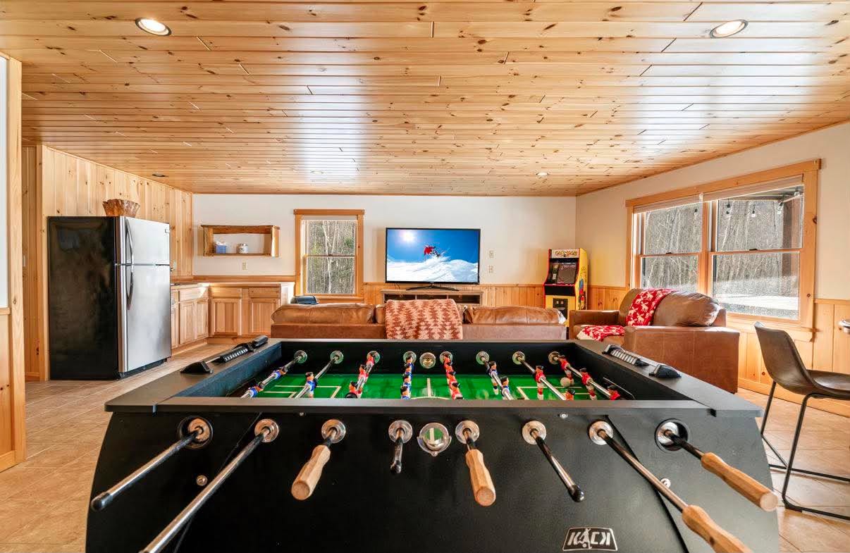 Game room: foosball, arcade, and a movie
