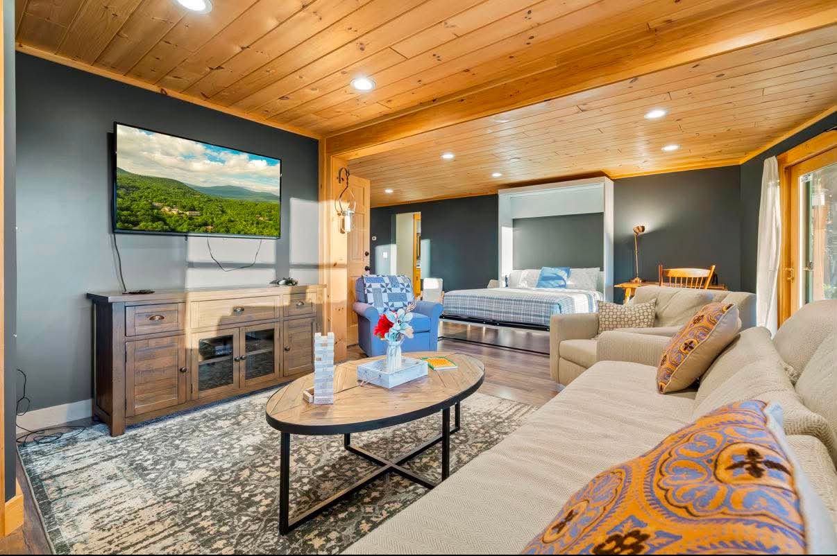 Suite lounge with a Murphy bed and a view